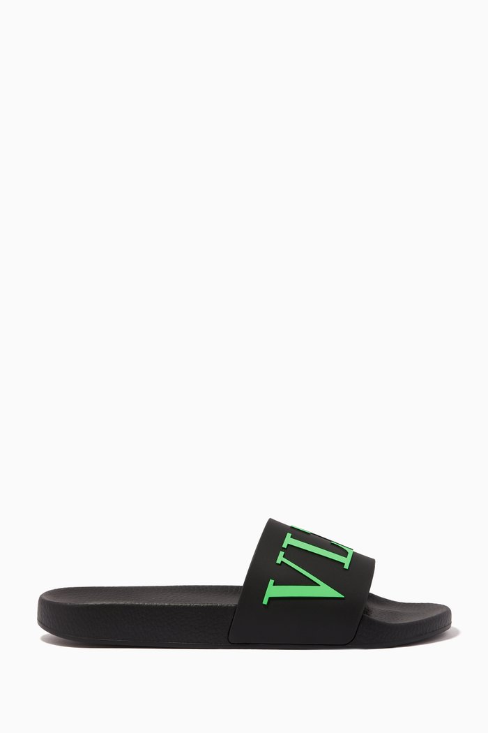 

Valentino Garavani Neon VLTN Slide Sandals in Rubber, Black