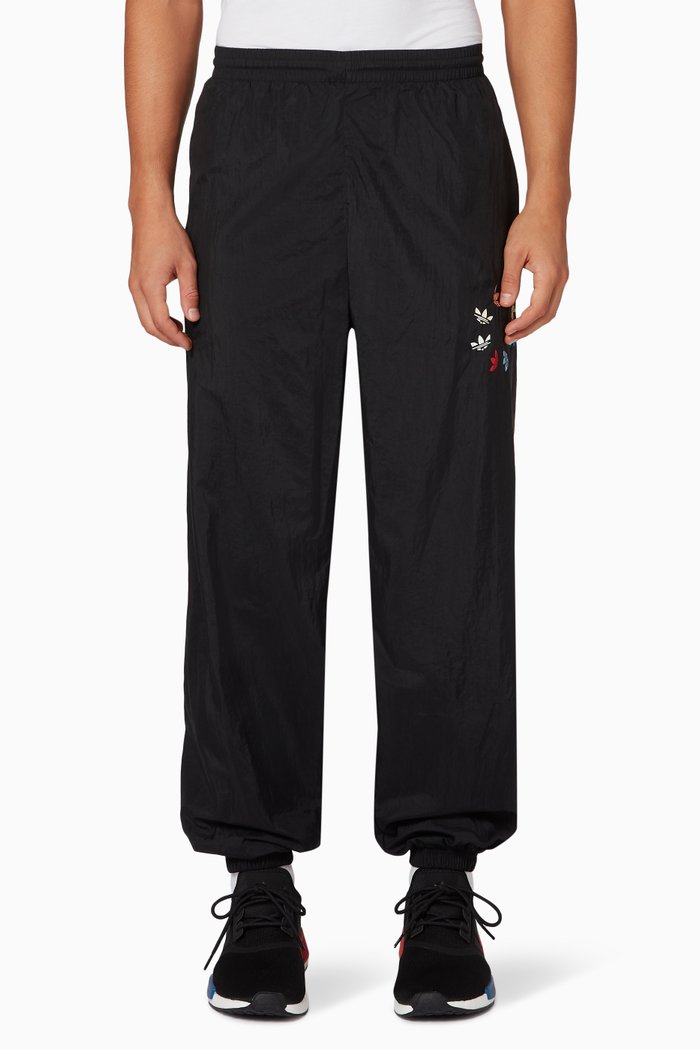 

Adicolor Swirl Trefoil Trackpants in Primegreen Nylon, Black