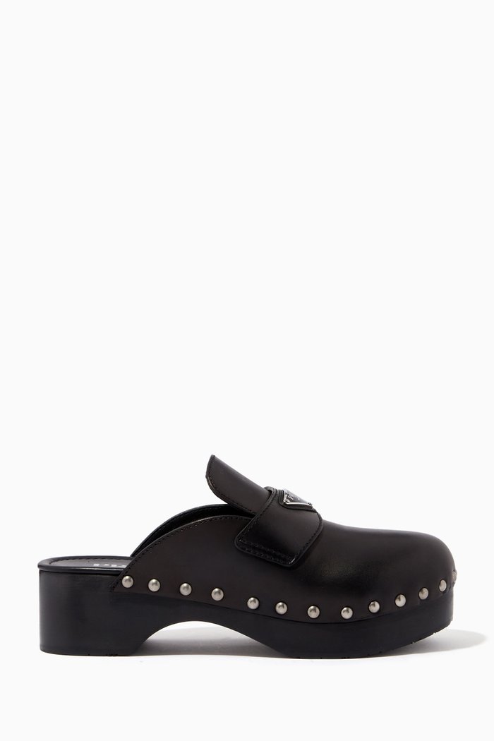 

Triangle Logo Studded Clogs in Leather, Black