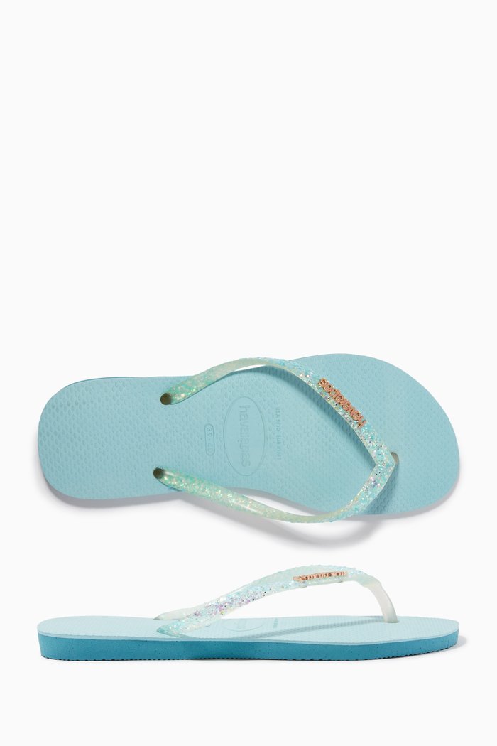

Slim Glitter Flourish Flip Flops in Rubber, Blue
