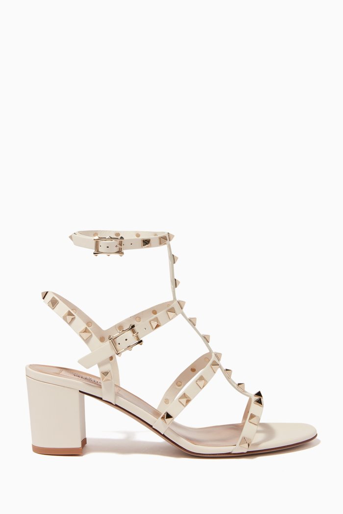 

Valentino Garavani Rockstud Caged Sandals in Leather, White