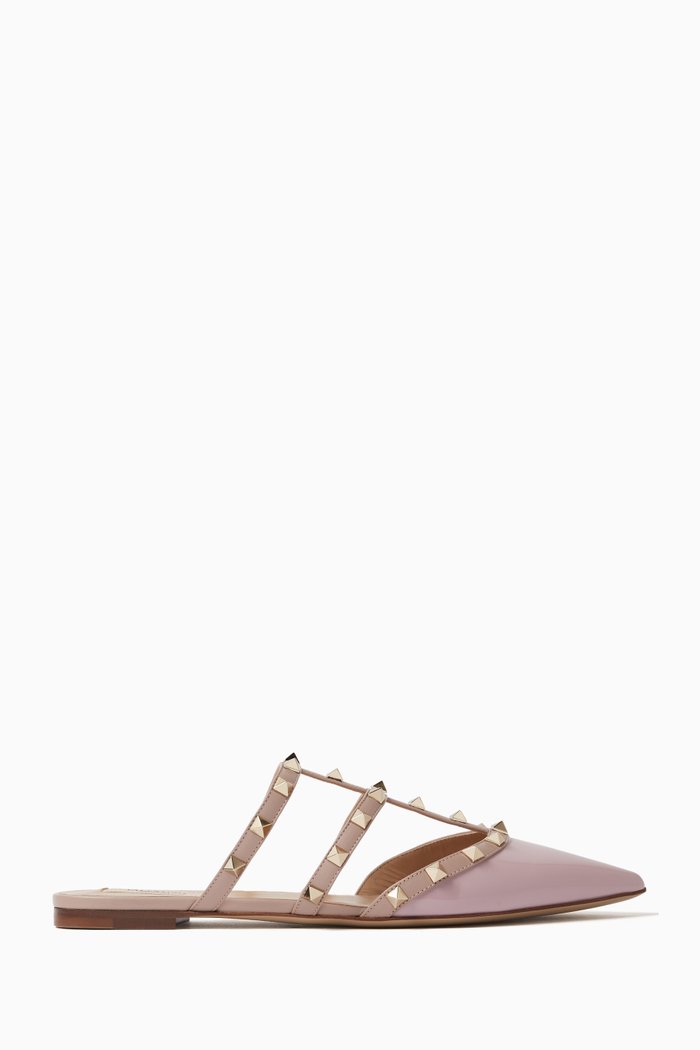 Valentino Garavani Rockstud Flat Mules in Patent Leather, Neutral