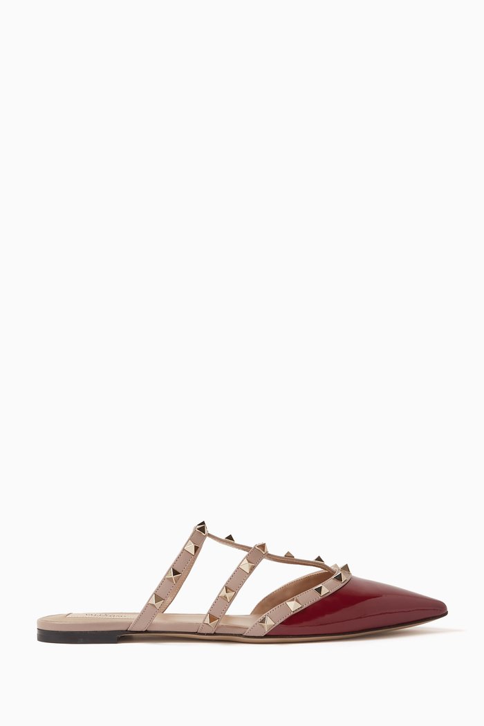 Valentino Garavani Rockstud Flat Mules in Patent Leather, Red