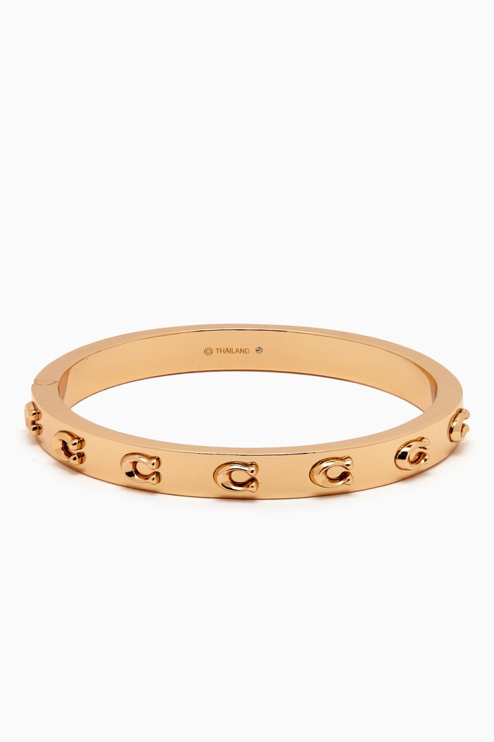 

Signature C Hinged Bangle in Metal, Gold
