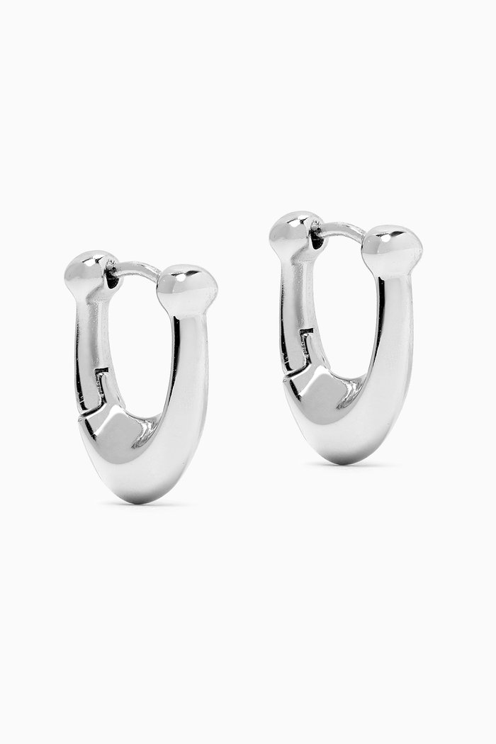 

Signature C Huggie Earrings in Metal, Silver