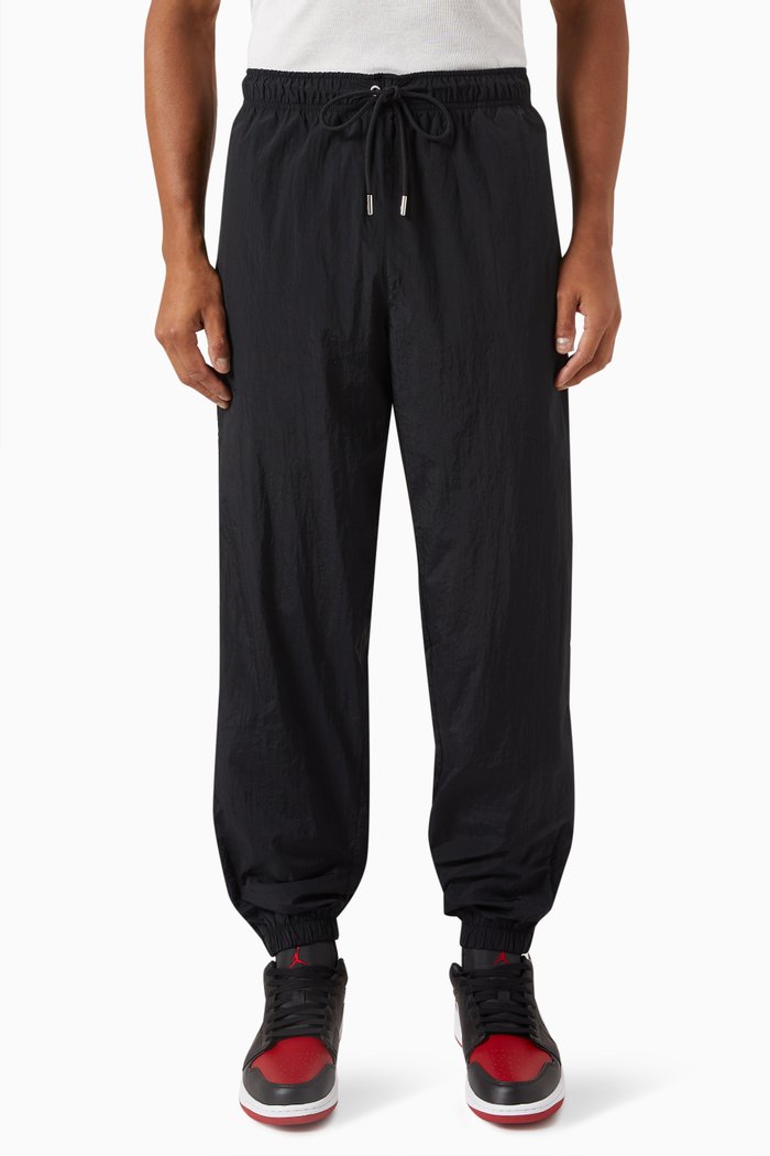 

Essentials Warm-up Pants in Nylon, Black