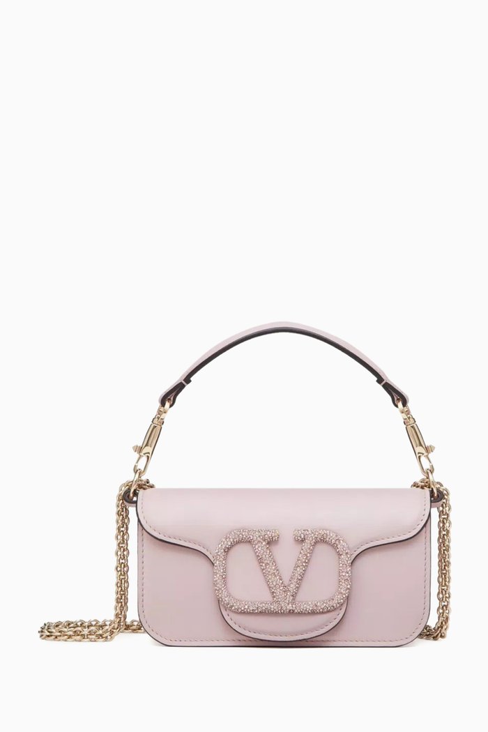 

Valentino Garavani Small Locò Embellished Shoulder Bag in Leather, Pink