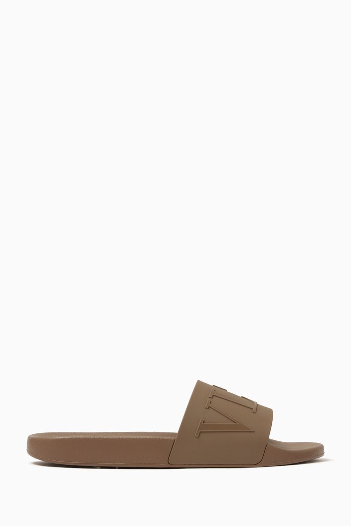 

Valentino Garavani VLTN Slide Sandals in Rubber, Neutral
