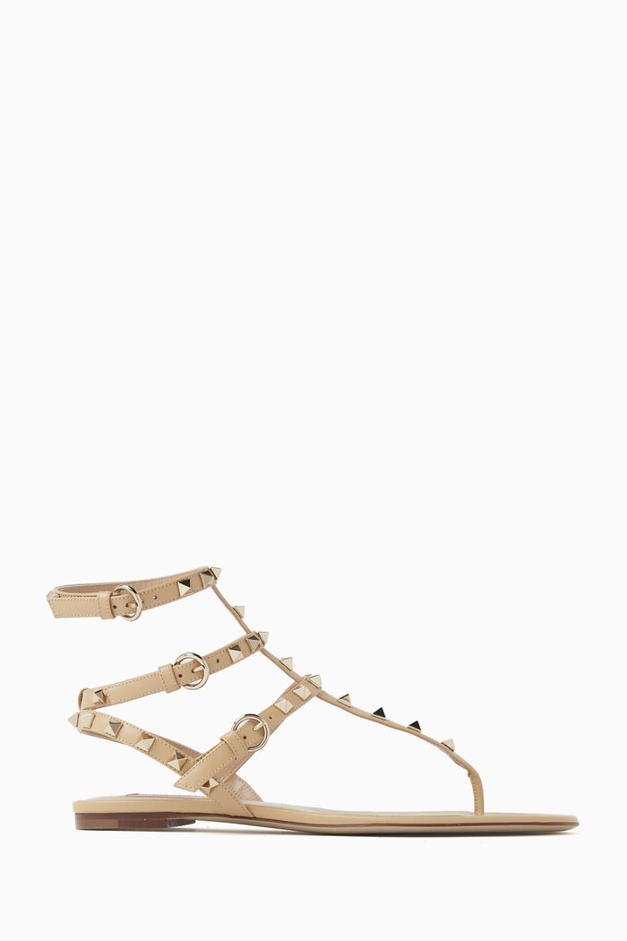 

Valentino Garavani Thong Rockstud Sandals in Nappa Leather, Neutral